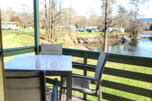 Your view from our riverfront cabin deck Accommodation Snowy Mountains Riverglade Caravan Park